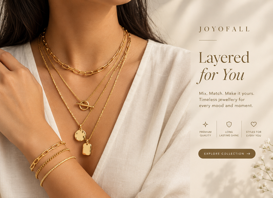 Layered gold-tone necklaces and bracelets styled with a white outfit, with Joyofall Layered for You text.